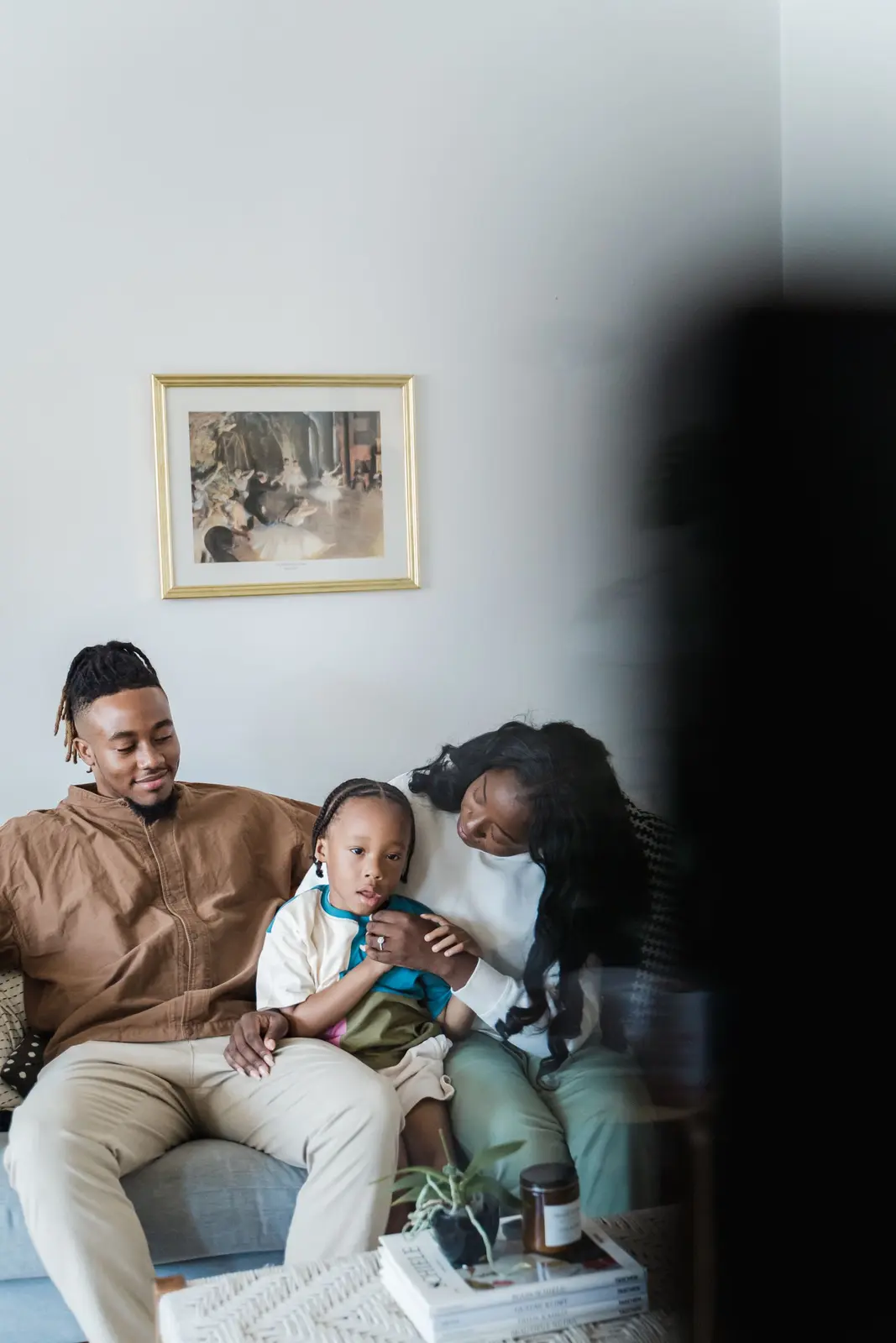 African family enjoying television together at home