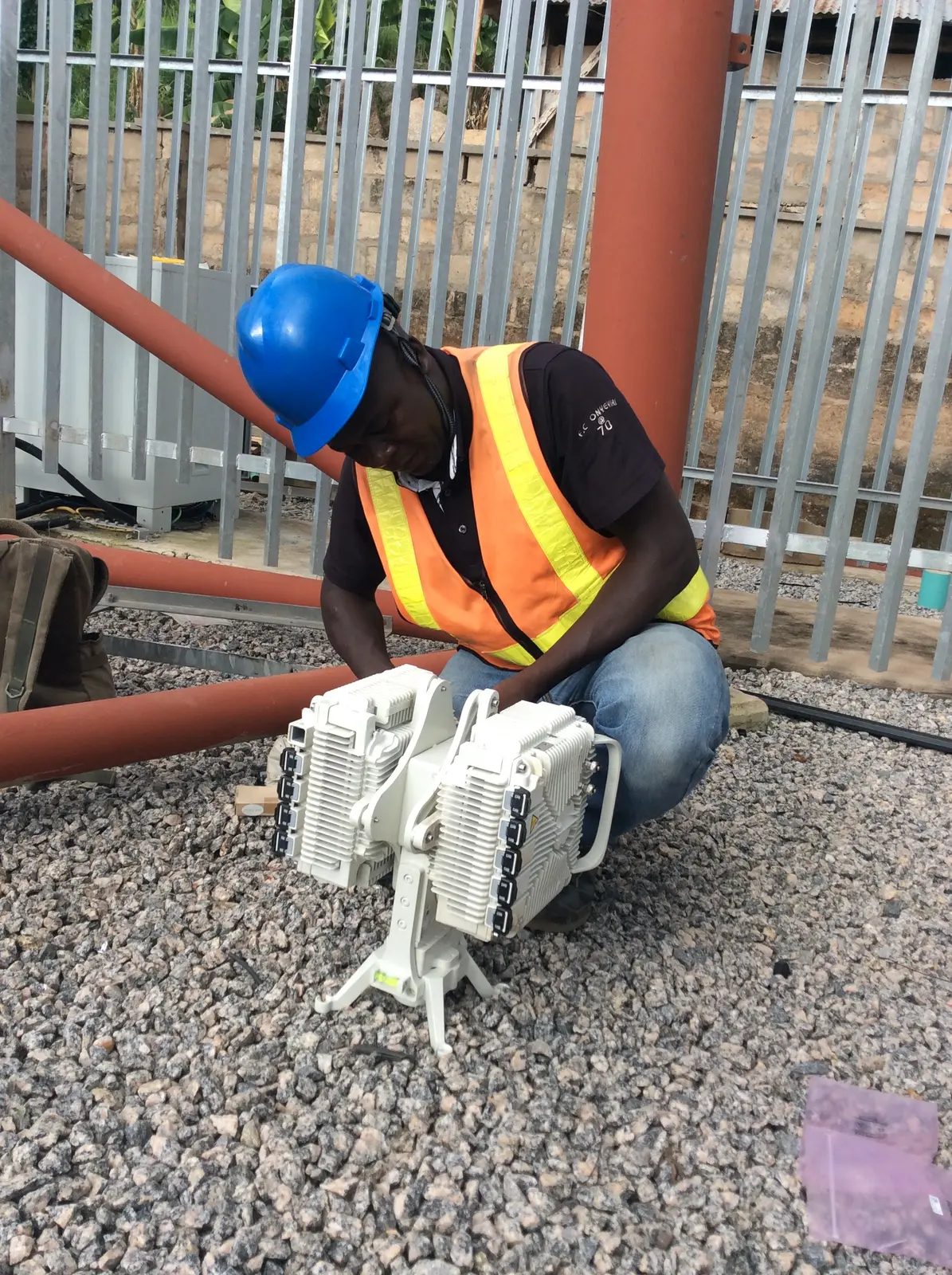 Kudos engineer preparing an outdoor radio unit for deployment
