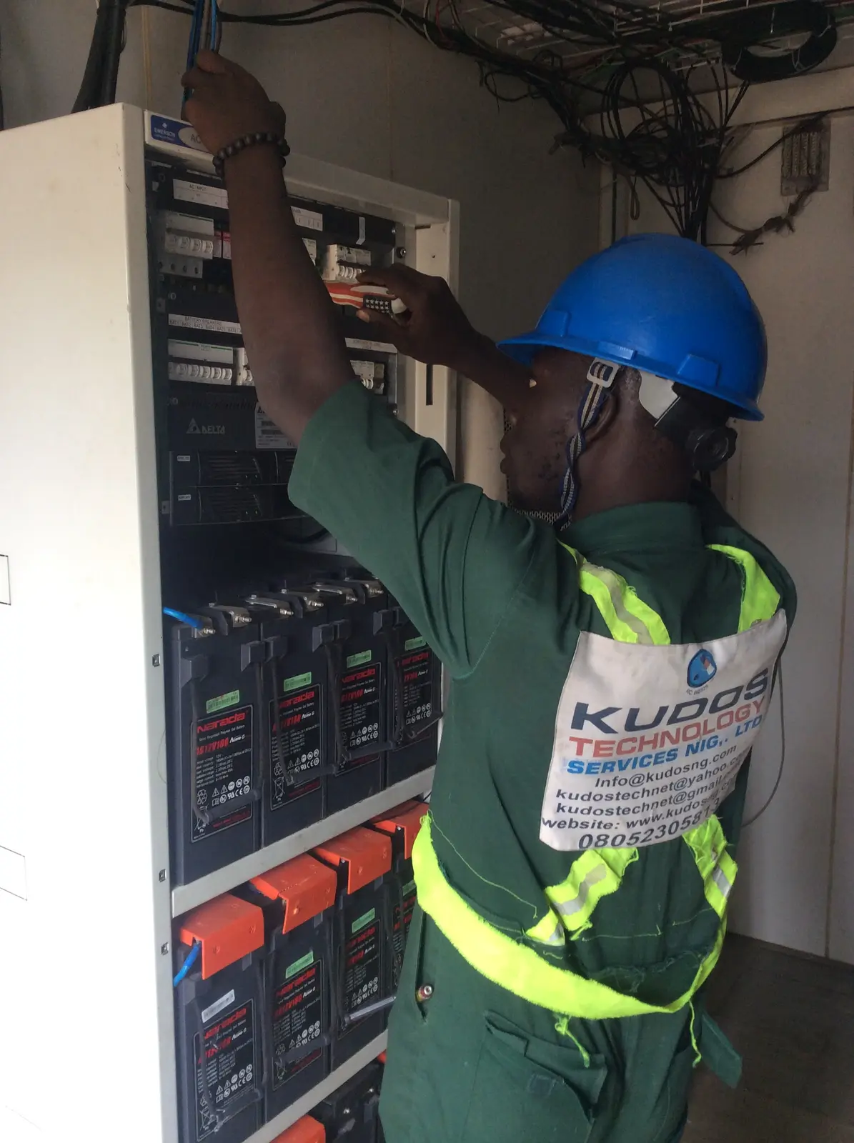 Kudos technician maintaining a site power system