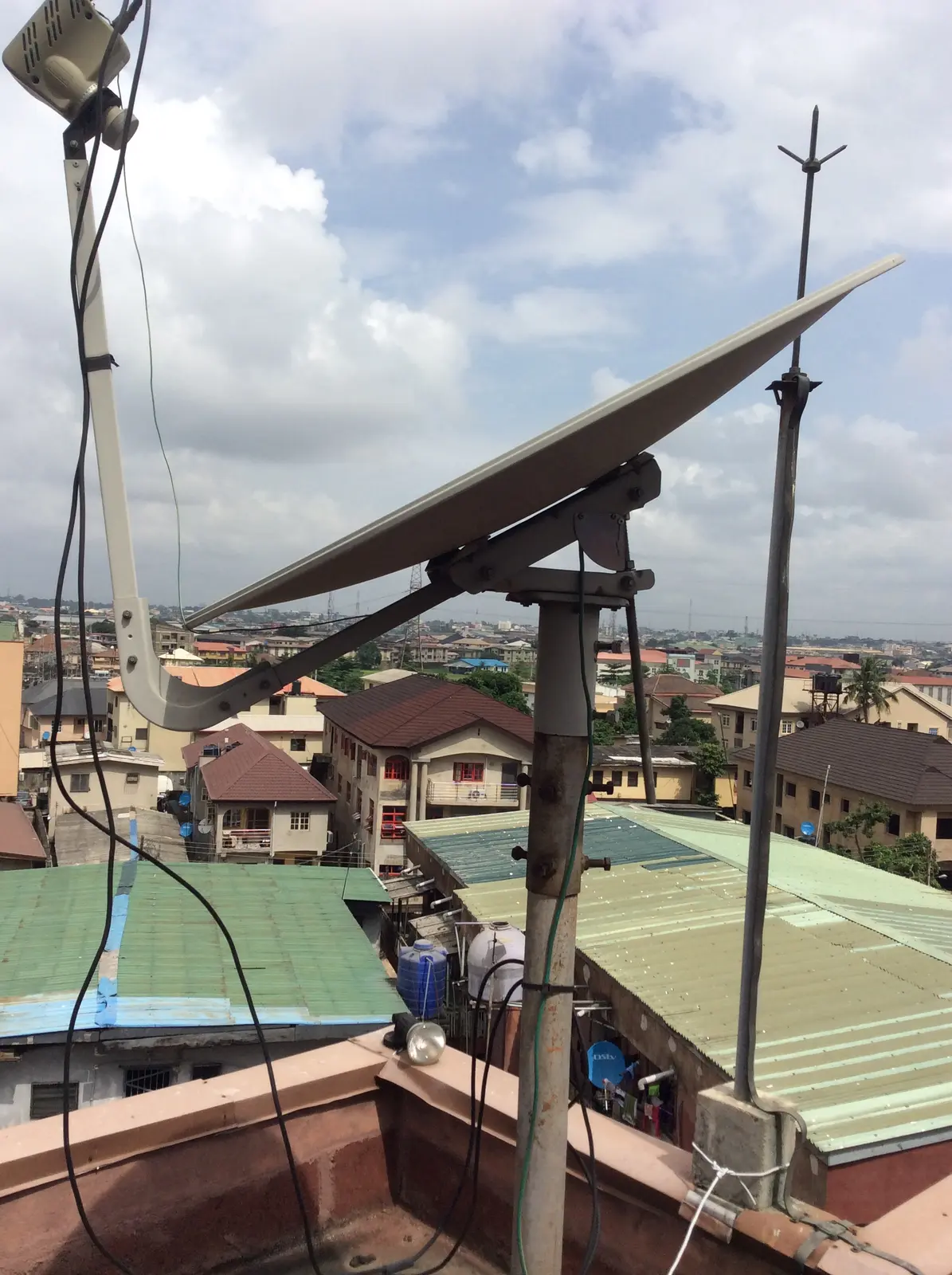 Mounted satellite dish aligned for communications service